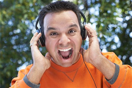 simsearch:640-01358873,k - Man Using Headphones Outdoors Stock Photo - Rights-Managed, Code: 700-00847056