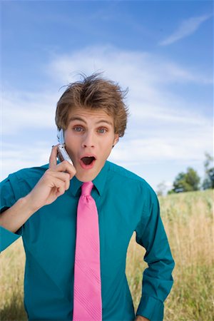 Young Man Using Cell Phone Stock Photo - Rights-Managed, Code: 700-00847424