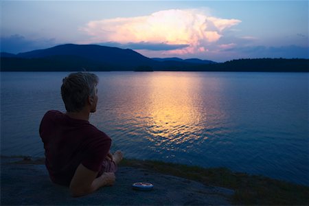 simsearch:6118-08088612,k - Man Watching Sunset Over Lake Stock Photo - Rights-Managed, Code: 700-00847614