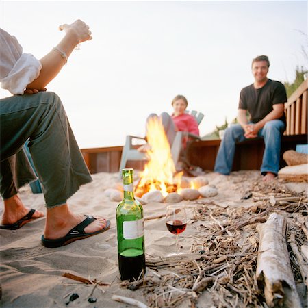 Friends Sitting Around Campfire Stock Photo - Rights-Managed, Code: 700-00847809