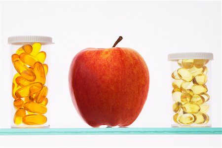 rick boden - Apple in Between Pill Bottles Stock Photo - Rights-Managed, Code: 700-00847910