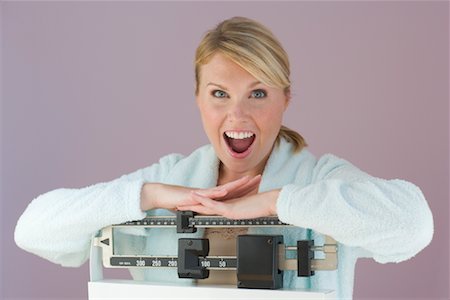 simsearch:700-01248936,k - Shocked Woman Leaning on Scale Stock Photo - Rights-Managed, Code: 700-00864067