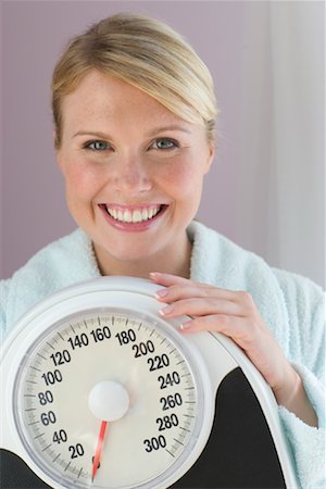 simsearch:700-00155082,k - Woman Holding Scale Stock Photo - Rights-Managed, Code: 700-00864062