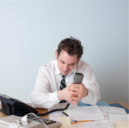 Businessman Using Telephone Stock Photo - Rights-Managed, Code: 700-00864317