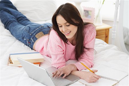 simsearch:640-05761338,k - Woman on Bed with Laptop Computer Stock Photo - Rights-Managed, Code: 700-00865015