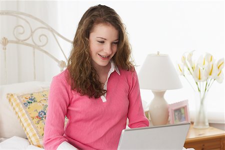 simsearch:700-00183100,k - Girl on Bed, Using Laptop Stock Photo - Rights-Managed, Code: 700-00865131