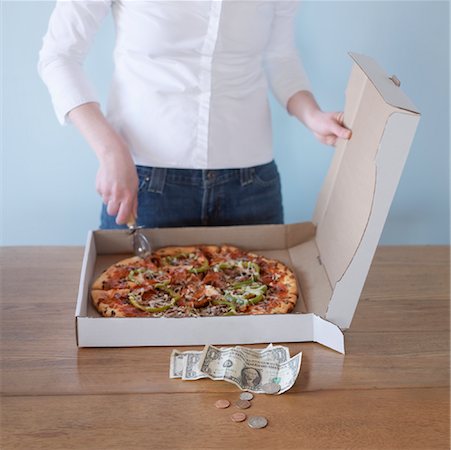 simsearch:700-00077839,k - Woman Cutting Pizza, Change on Table Stock Photo - Rights-Managed, Code: 700-00865221