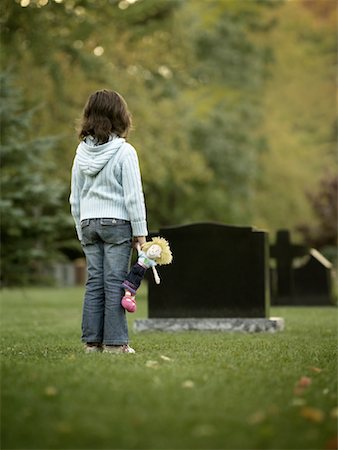 Girl Visiting Grave Stock Photo - Rights-Managed, Code: 700-00865256