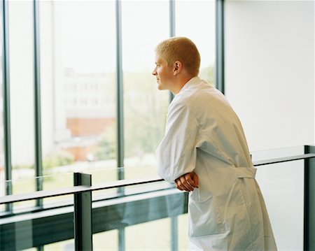 special needs - Man in Lab Coat Looking Out Window Stock Photo - Rights-Managed, Code: 700-00865293