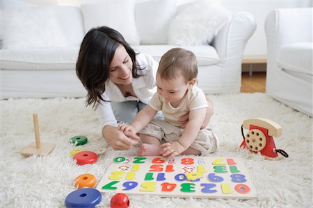 Woman Playing with Son in Living Room Stock Photo - Rights-Managed, Code: 700-00865690