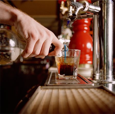 simsearch:6102-03828319,k - Hand of Bartender Mixing Drink Stock Photo - Rights-Managed, Code: 700-00867115