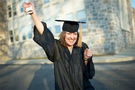 simsearch:700-02757219,k - Mature Woman Smiling and Holding Diploma Stock Photo - Rights-Managed, Code: 700-00897202