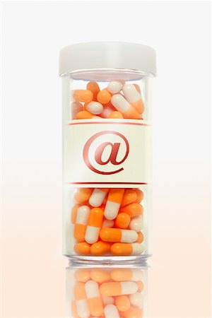 Bottle of Pills with @ Symbol Stock Photo - Rights-Managed, Code: 700-00909485