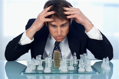 Man Looking at Cactus On Chessboard Stock Photo - Rights-Managed, Code: 700-00909697