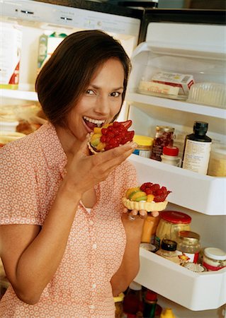 Woman Eating Mixed Fruit Stock Photo - Rights-Managed, Code: 700-00916892
