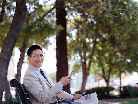 simsearch:700-00184999,k - Businessman in Park with Cellular Phone Foto de stock - Con derechos protegidos, Código: 700-00918053