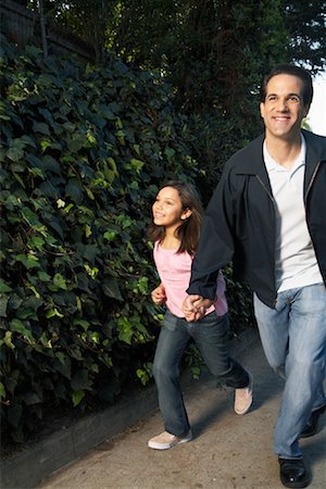 Father and Daughter Running Down The Street Stock Photo - Rights-Managed, Code: 700-00918083