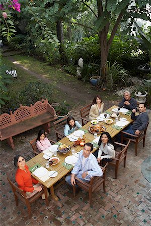 dinner with big family table food - Family Having Dinner Outdoors Stock Photo - Rights-Managed, Code: 700-00918130