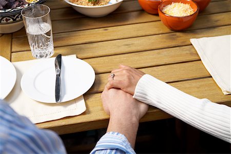 placing cutlery on table - Couple Holding Hands Stock Photo - Rights-Managed, Code: 700-00918144