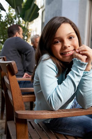 Girl At Family Dinner Outdoors Foto de stock - Con derechos protegidos, Código: 700-00918147