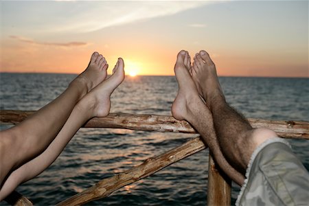 Couple's Feet Up on Railing Stock Photo - Rights-Managed, Code: 700-00918368