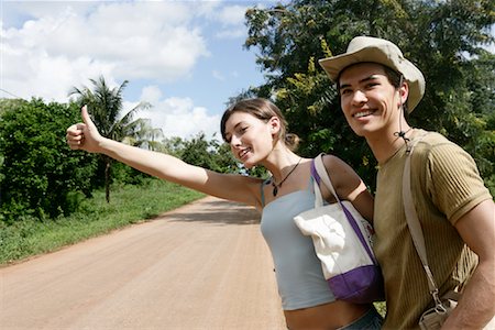 Couple Hitchhiking, Zanzibar, Tanzania Stock Photo - Rights-Managed, Code: 700-00918360