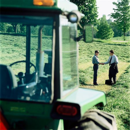 farmer standing tractor - Farmer and Businessman Shaking Hands Stock Photo - Rights-Managed, Code: 700-00910090