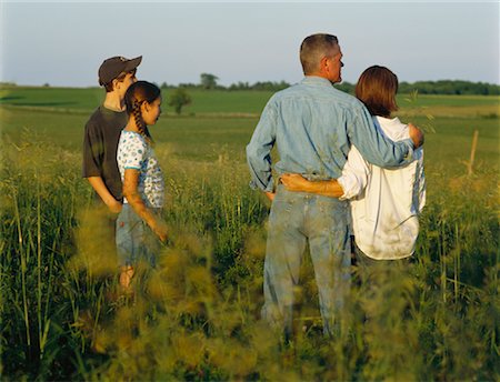 family four 15 years parents - Family Standing in Field Stock Photo - Rights-Managed, Code: 700-00910130