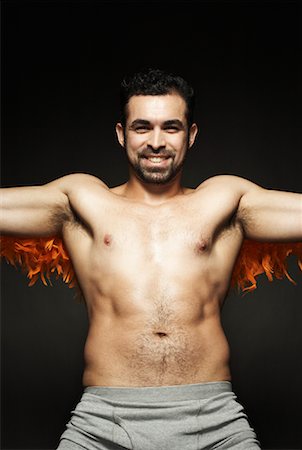 Homme torse nu avec Feather Boa Photographie de stock - Rights-Managed, Code: 700-00910246