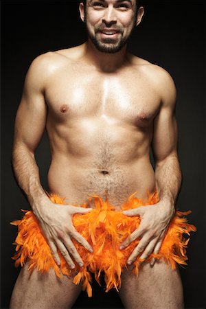 Shirtless Man with Feather Boa Stock Photo - Rights-Managed, Code: 700-00910247