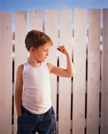 Boy Flexing His Muscles Stock Photo - Rights-Managed, Code: 700-00911734