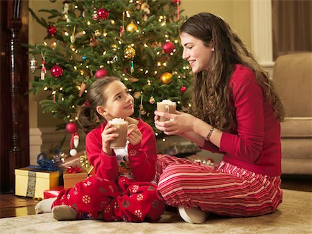 Girls Drinking Hot Chocolate At Christmas Stock Photo - Rights-Managed, Code: 700-00911843