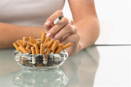 Woman Smoking Excessively Stock Photo - Rights-Managed, Code: 700-00934512