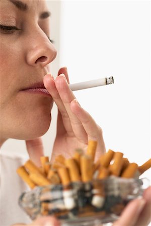 Woman Smoking Excessively Stock Photo - Rights-Managed, Code: 700-00934513