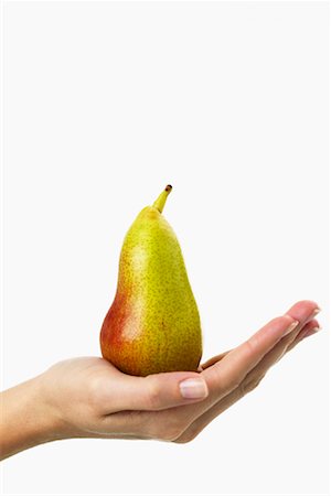 simsearch:700-00748140,k - Woman's Hand Holding Pear Stock Photo - Rights-Managed, Code: 700-00934522