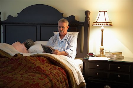 Man Sitting on Bed Stock Photo - Rights-Managed, Code: 700-00935107