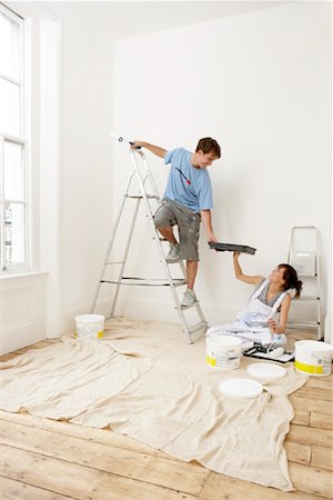 Couple Painting New Home Foto de stock - Con derechos protegidos, Código: 700-00933791