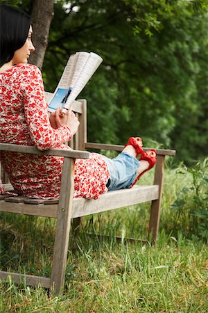 Woman Sitting On Park Bench Reading Stock Photo - Rights-Managed, Code: 700-00954501