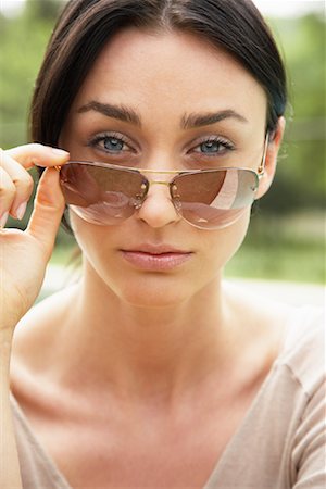 simsearch:700-00954536,k - Woman Looking Over Sunglasses Stock Photo - Rights-Managed, Code: 700-00954537