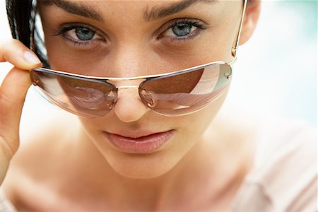 simsearch:700-00954536,k - Woman Looking Over Sunglasses Stock Photo - Rights-Managed, Code: 700-00954538