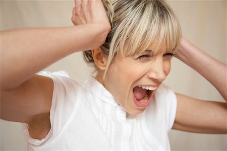 simsearch:700-02130447,k - Woman Holding Her Head And Screaming Stock Photo - Rights-Managed, Code: 700-00954585