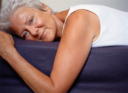 portrait and woman and closeup and arms - Portrait of Woman Lying Down Stock Photo - Rights-Managed, Code: 700-00954616