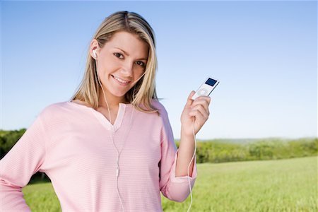 Portrait of Woman with MP3 Player Stock Photo - Rights-Managed, Code: 700-00955668