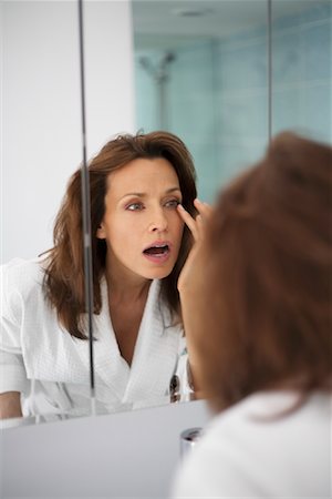 simsearch:700-01165022,k - Woman Looking in Mirror Stock Photo - Rights-Managed, Code: 700-00983114