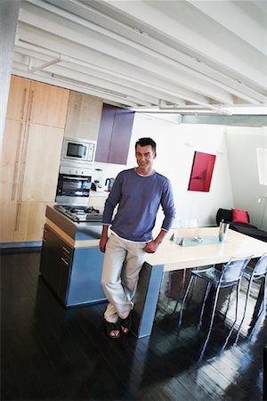 Man Standing in Kitchen Stock Photo - Rights-Managed, Code: 700-00983153