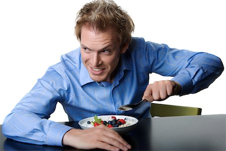 ruprecht stempell - Man Eating Cereal Fotografie stock - Rights-Managed, Codice: 700-01014440