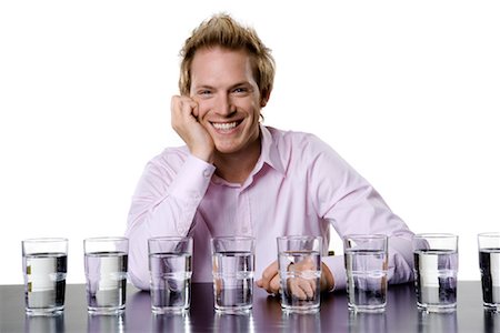 satisfied (thirst) - Man With Glasses of Water Foto de stock - Con derechos protegidos, Código: 700-01014474