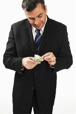 Businessman Counting Money Stock Photo - Rights-Managed, Code: 700-01014984