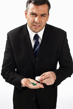 Businessman with Medicine Stock Photo - Rights-Managed, Code: 700-01014992
