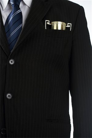 poche de veste - Homme d'affaires avec le trophée en poche Photographie de stock - Rights-Managed, Code: 700-01015002